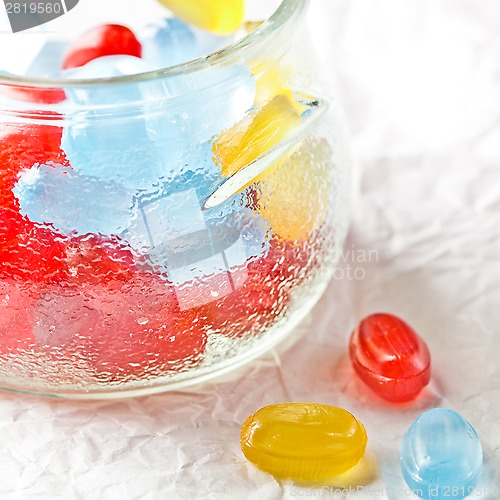 Image of colorful candies in glass jar