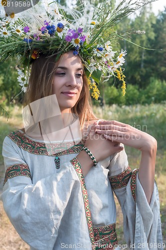 Image of Young beautiful woman with flower wreath