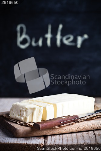 Image of fresh butter and blackboard 