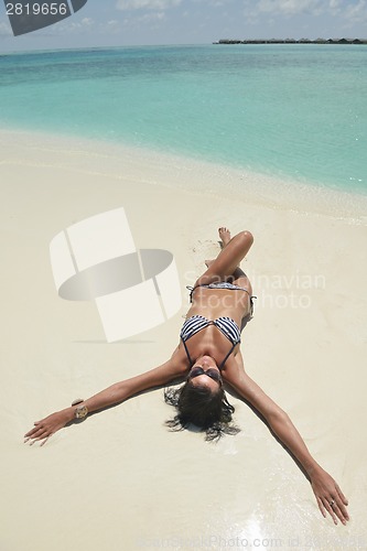 Image of beautiful young woman  on beach have fun and relax