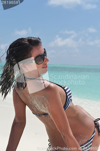 Image of beautiful young woman  on beach have fun and relax