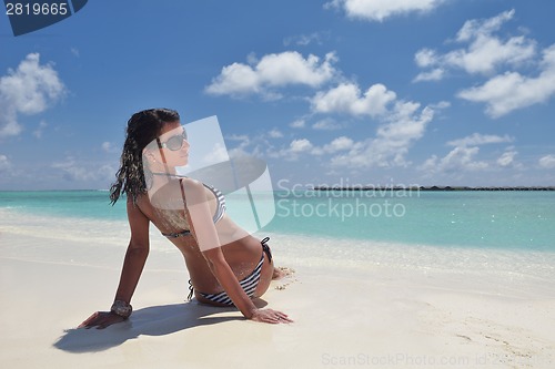 Image of beautiful young woman  on beach have fun and relax