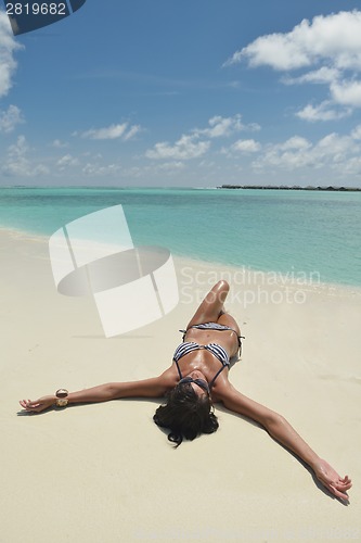 Image of beautiful young woman  on beach have fun and relax