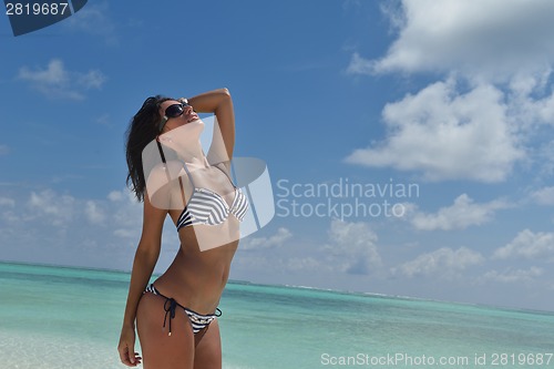 Image of beautiful young woman  on beach have fun and relax