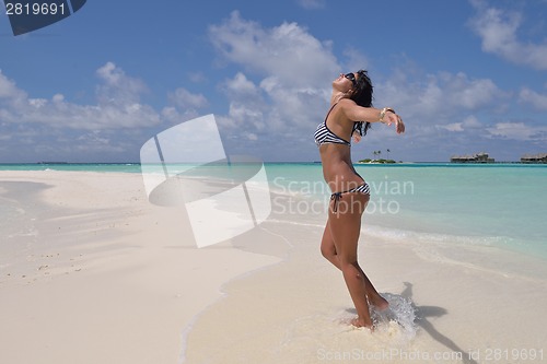 Image of beautiful young woman  on beach have fun and relax