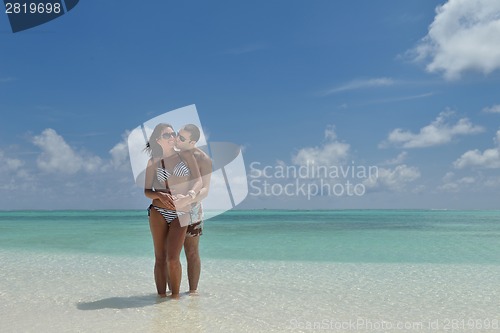 Image of happy young couple have fun on beach