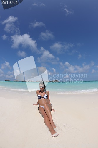 Image of beautiful young woman  on beach have fun and relax