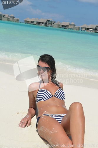 Image of beautiful young woman  on beach have fun and relax