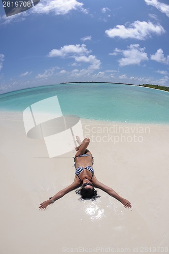 Image of happy young couple have fun on beach