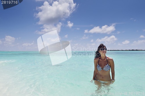 Image of beautiful young woman  on beach have fun and relax