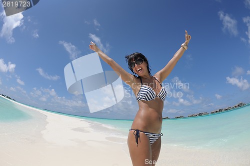 Image of beautiful young woman  on beach have fun and relax