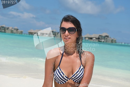 Image of beautiful young woman  on beach have fun and relax