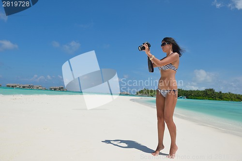 Image of beautiful young woman  on beach have fun and relax