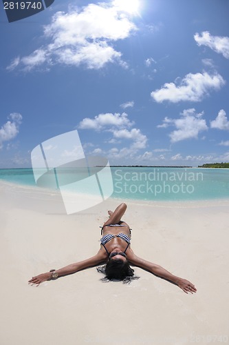 Image of beautiful young woman  on beach have fun and relax