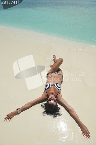 Image of beautiful young woman  on beach have fun and relax