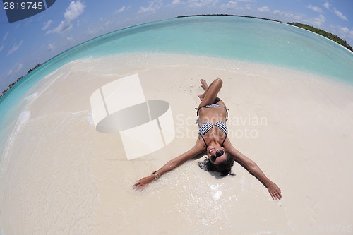 Image of beautiful young woman  on beach have fun and relax