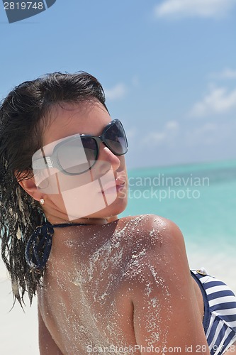 Image of beautiful young woman  on beach have fun and relax