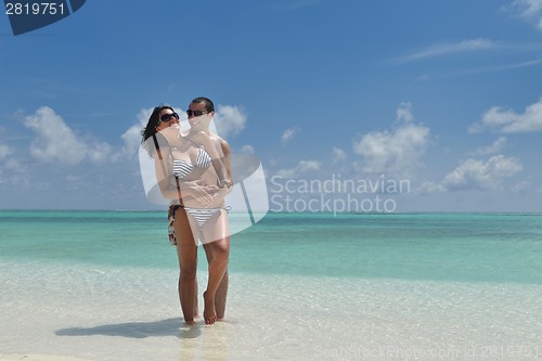 Image of happy young couple have fun on beach