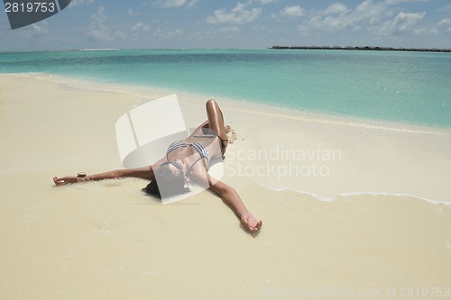 Image of beautiful young woman  on beach have fun and relax