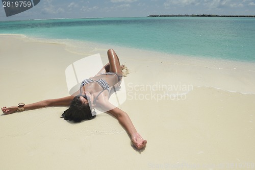 Image of beautiful young woman  on beach have fun and relax