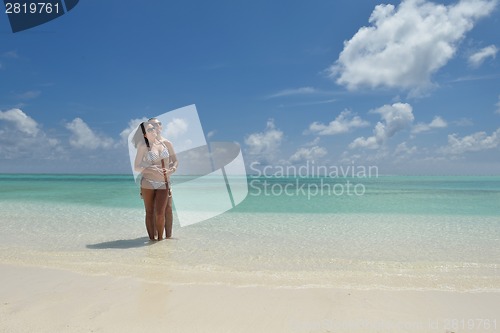 Image of happy young couple have fun on beach