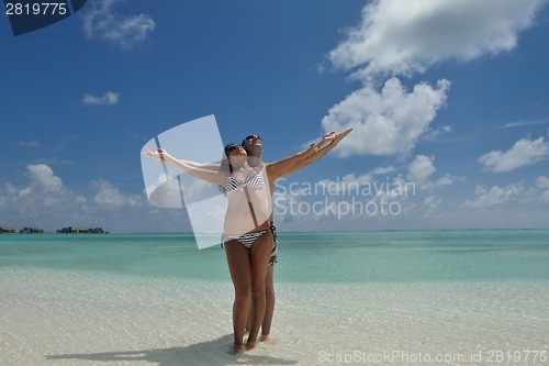 Image of happy young couple have fun on beach