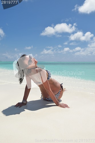 Image of beautiful young woman  on beach have fun and relax