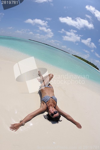 Image of beautiful young woman  on beach have fun and relax