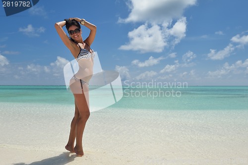 Image of beautiful young woman  on beach have fun and relax