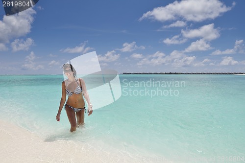 Image of beautiful young woman  on beach have fun and relax