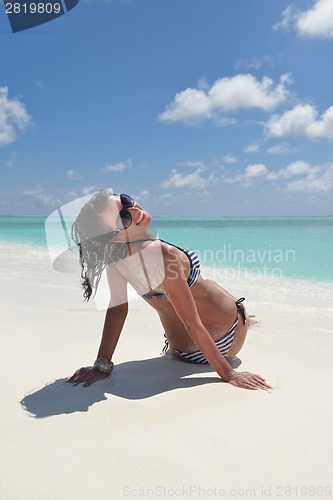 Image of beautiful young woman  on beach have fun and relax