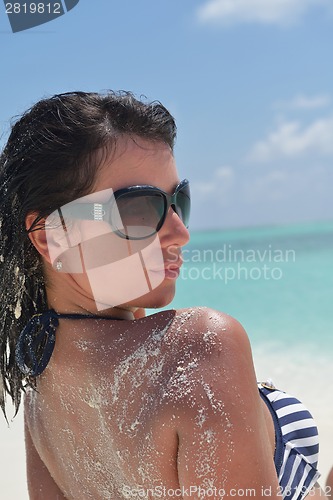 Image of beautiful young woman  on beach have fun and relax