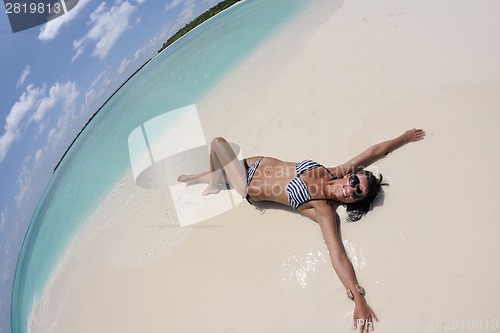 Image of beautiful young woman  on beach have fun and relax
