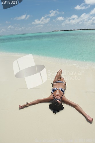 Image of beautiful young woman  on beach have fun and relax