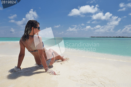 Image of beautiful young woman  on beach have fun and relax