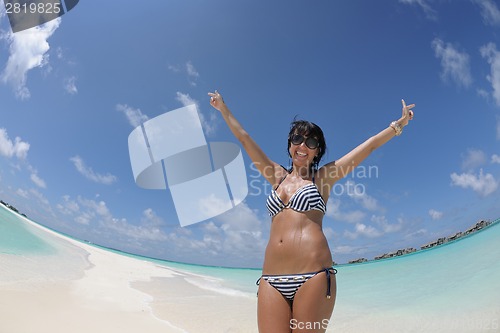 Image of beautiful young woman  on beach have fun and relax
