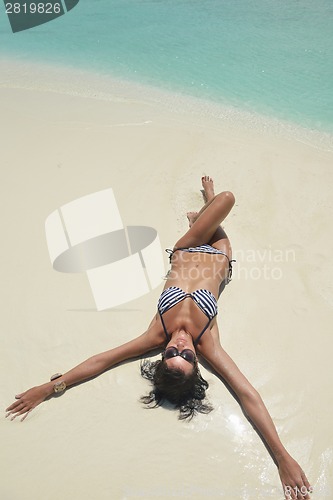 Image of beautiful young woman  on beach have fun and relax