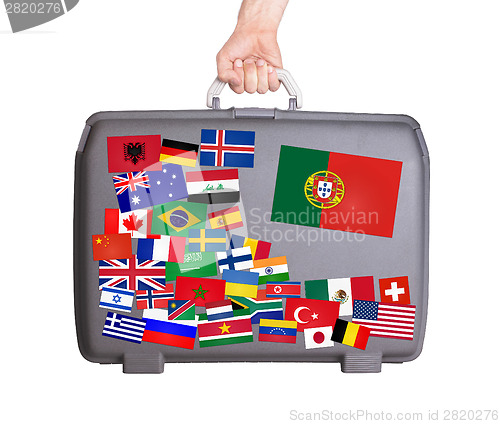 Image of Used plastic suitcase with stickers