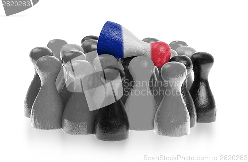 Image of One unique pawn on top of common pawns