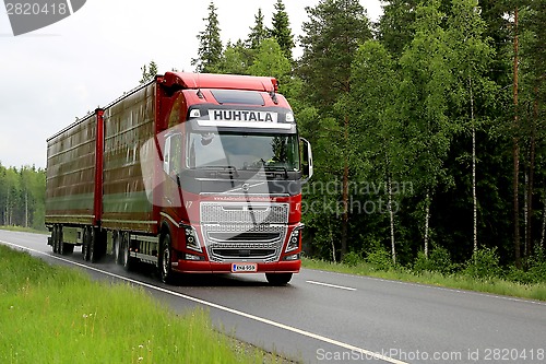 Image of Red Volvo FH16 Truck on Summer Highway