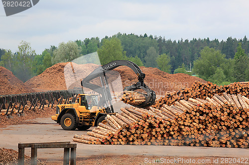 Image of Volvo L180F HL Log Loader Working at Lumber Yard