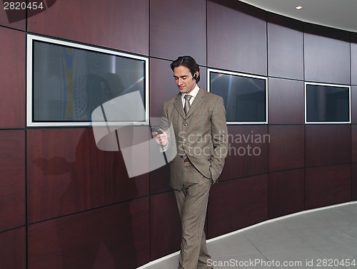 Image of Businessman talking on mobile phone ll