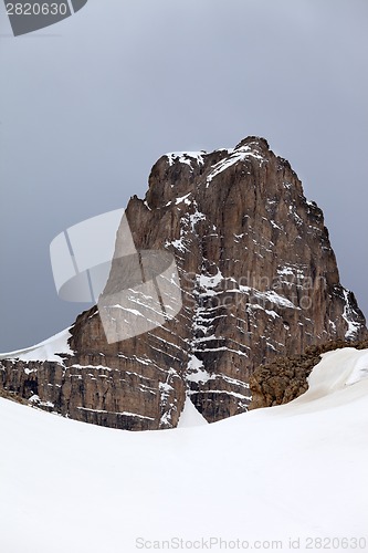 Image of Snow rocks and gray sky