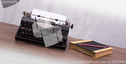 Image of Vintage typewriter and old books