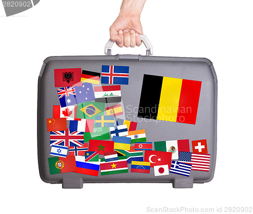 Image of Used plastic suitcase with stickers