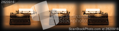 Image of Old typewriter on wooden table