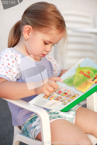 Image of Cute girl reading