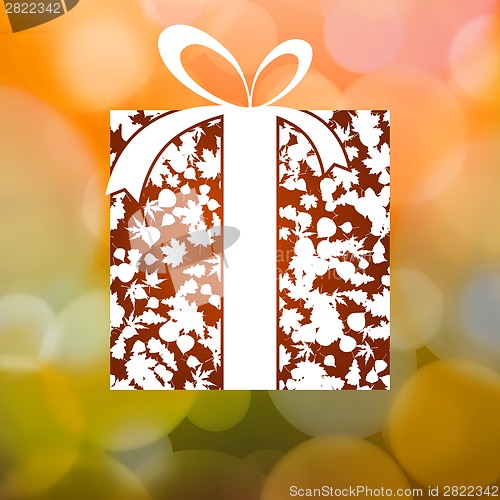 Image of Gift from Autumn leaves background. EPS 8