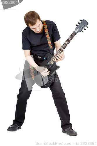 Image of Man on a white background. Performer with an electric guitar