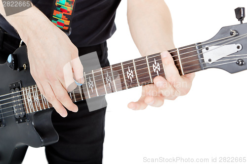 Image of Man on a white background. Performer with an electric guitar